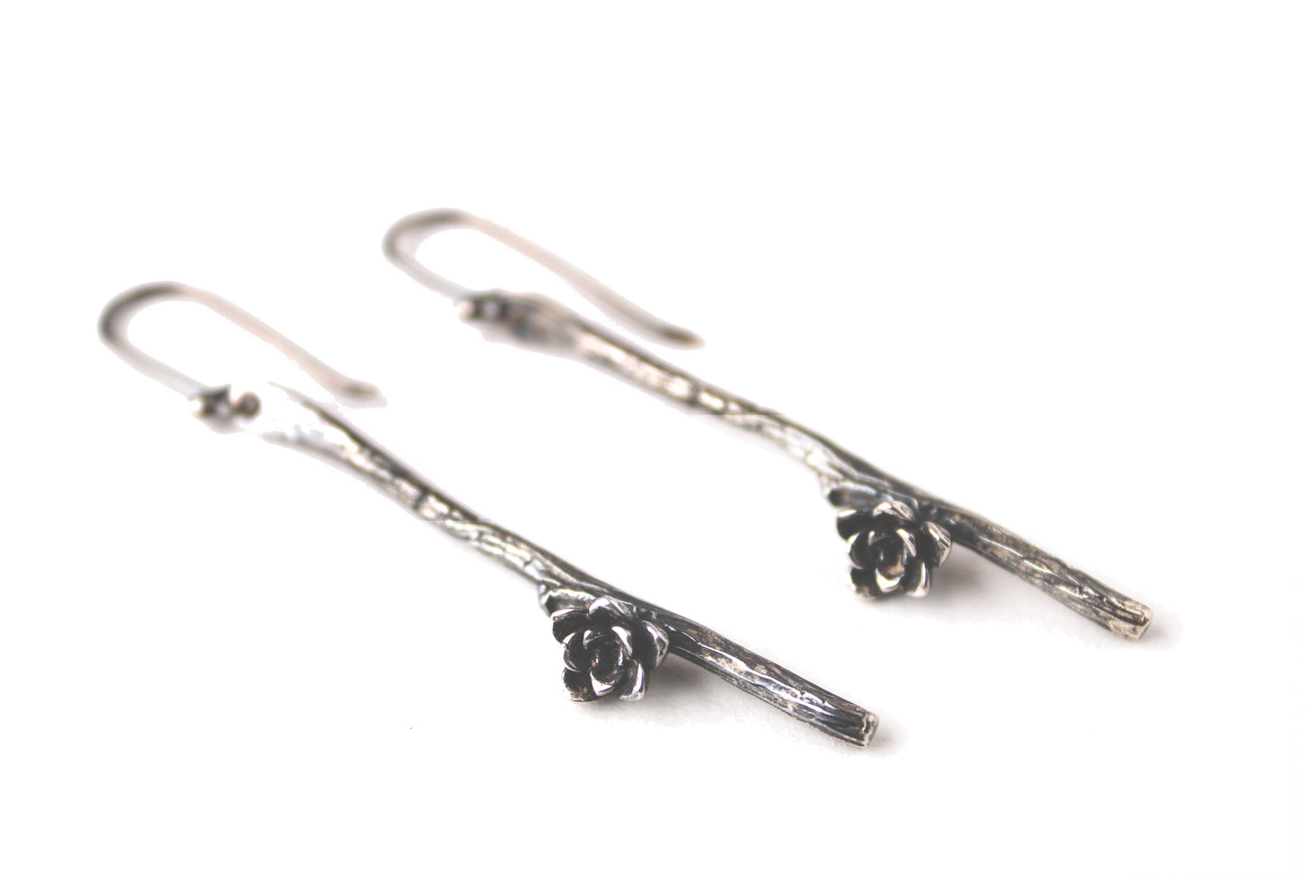 Earrings: twig single: bright silver: long